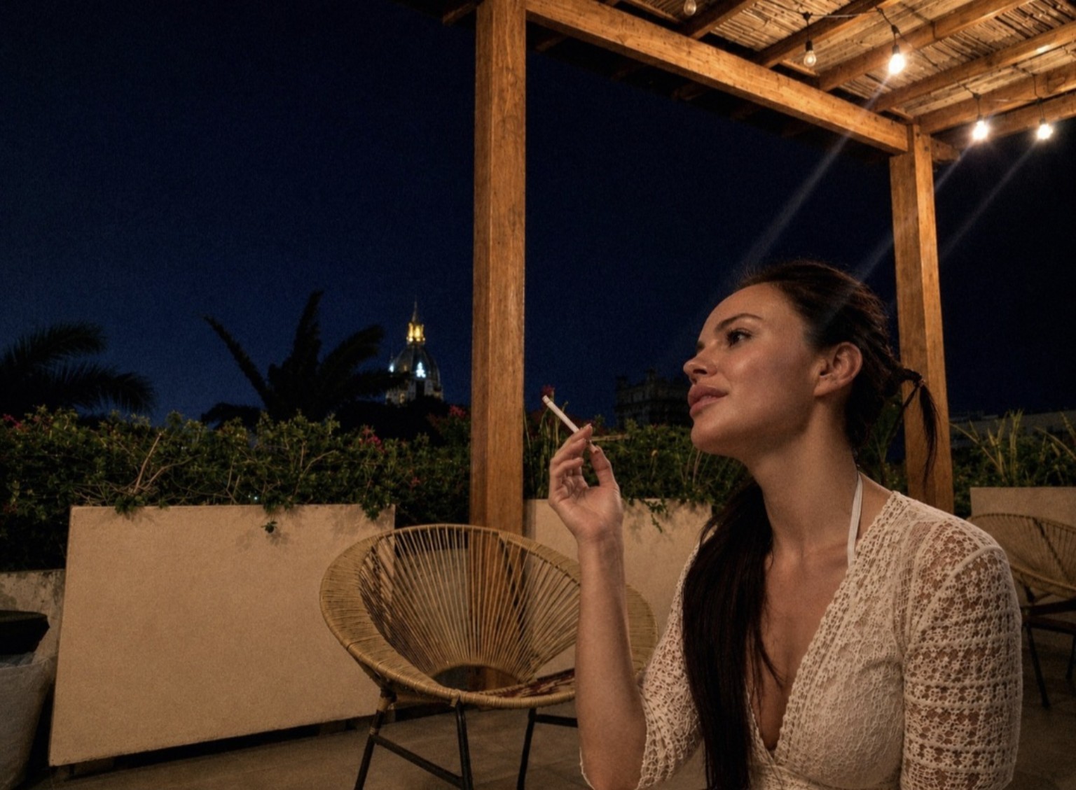 Gail Norman Casas on a nighttime Cartagena terrace